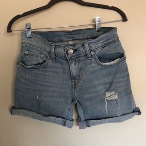 Midi shorts. Medium blue with rips.